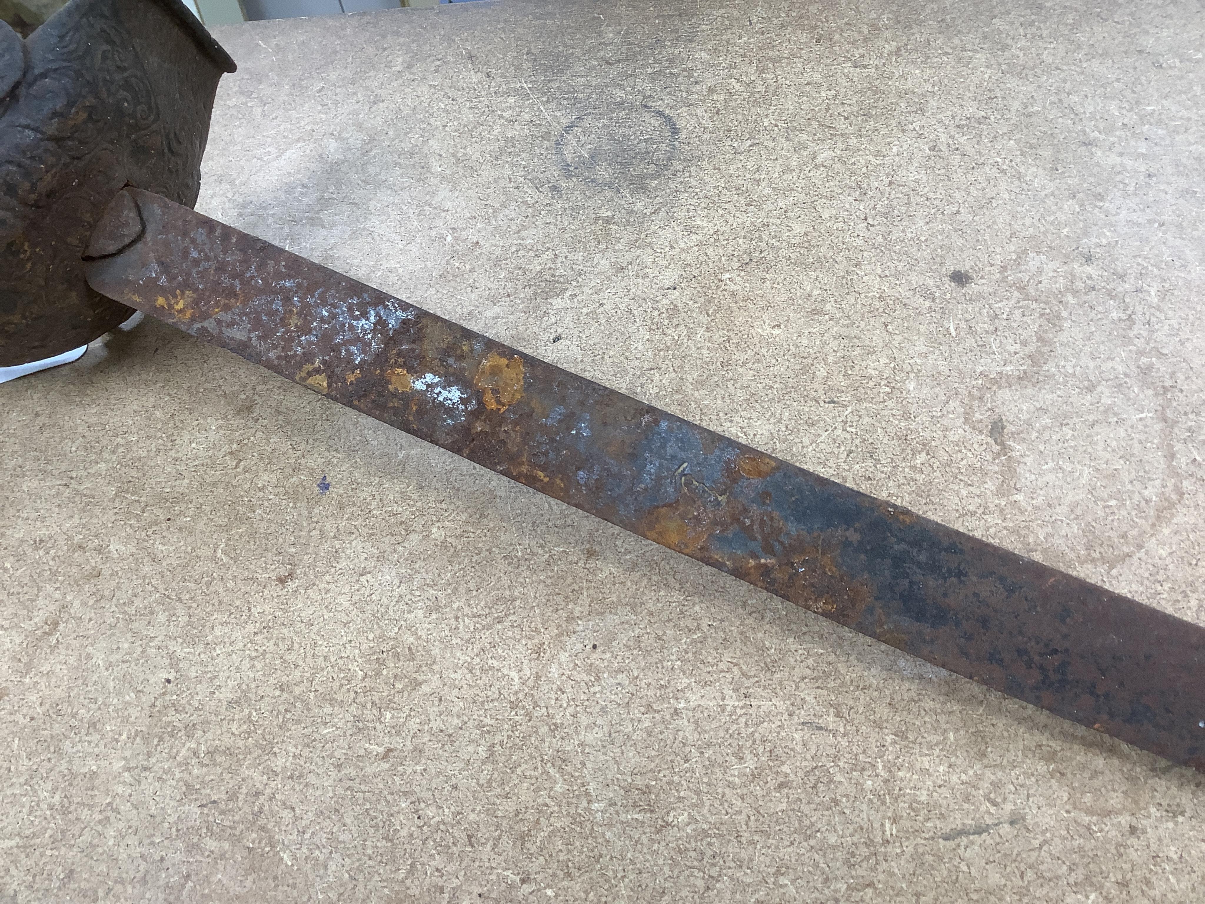 An English Civil War period cavalry officer’s sabre, curved single edge blade, struck with crescent moon, ‘mortuary’ hilt chiselled with scrolling foliage, swollen chiselled pommel, wooden grip, blade 71.5cm. Condition -